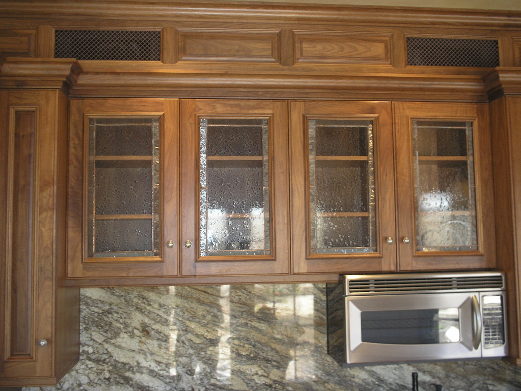 Picture of 4 stained glass panels in kitchen cabinets