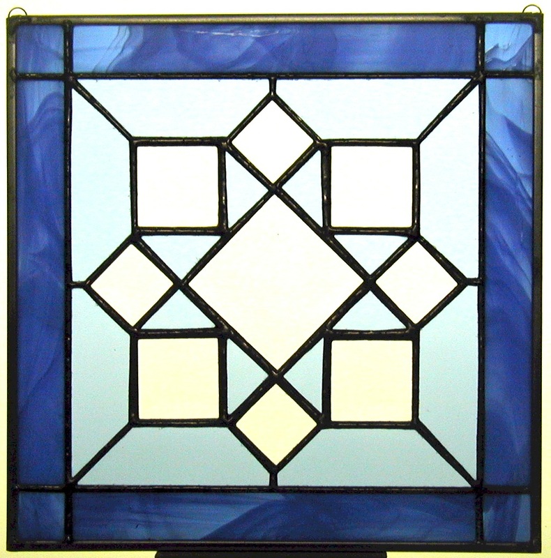 Picture Of June Stained Glass Quilt Block With Blue Border 